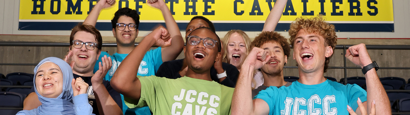 students cheering in bleachers