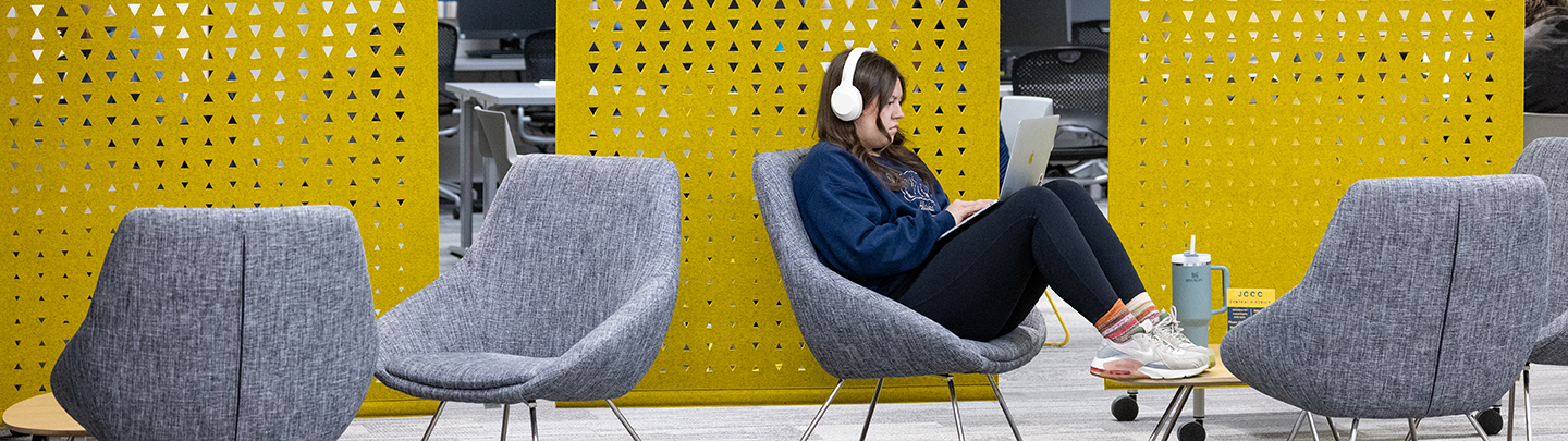 student studying in commons area