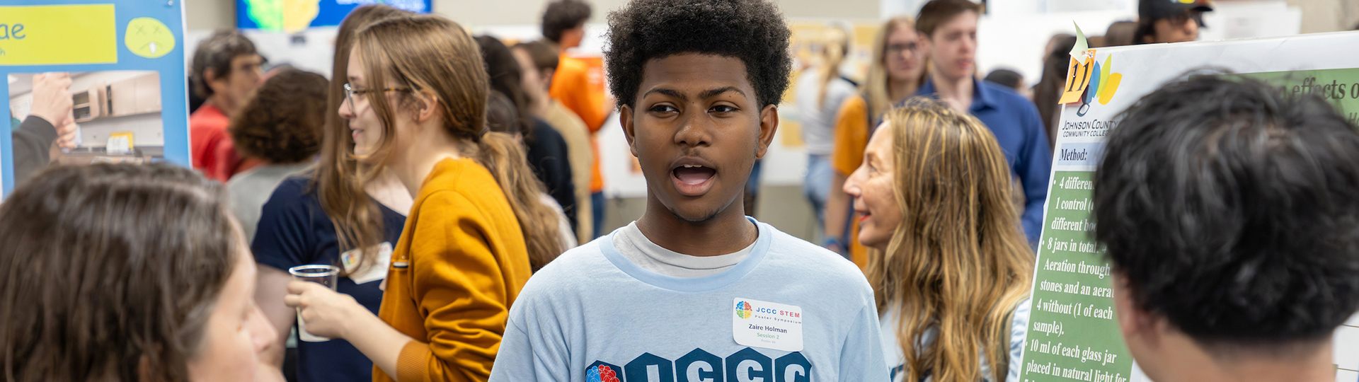 a student presenting research at the JCCC STEM Poster Symposium